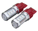 Pair of 7443 dual-color LED bulbs featuring red base and silver aluminum body.